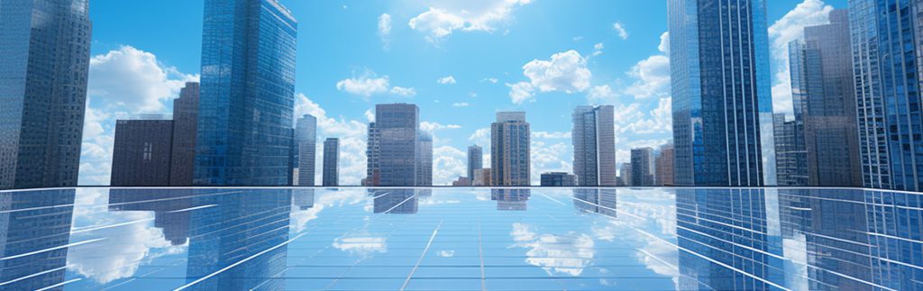 Modern city skyline reflected on a glass surface under a bright blue sky, symbolizing urban growth, innovation, and futuristic real estate development.